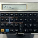 A financial calculator with the input value of 212, the water boiling point at sea level.